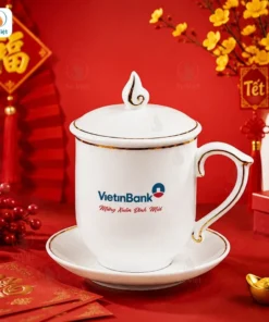 Cốc Sứ Sen Nước Kẻ Vàng In Logo Quà Tết